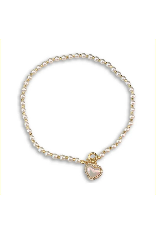 Pearl and gold bead necklace with heart pendant.